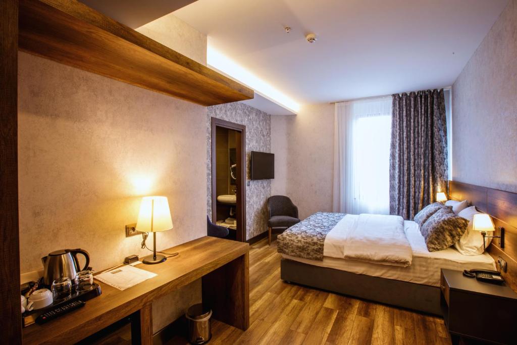 Postel nebo postele na pokoji v ubytování Life Point Hotel