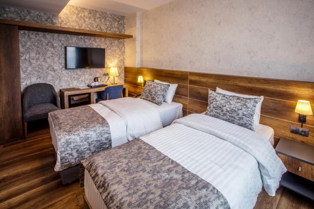 Postel nebo postele na pokoji v ubytování Life Point Hotel