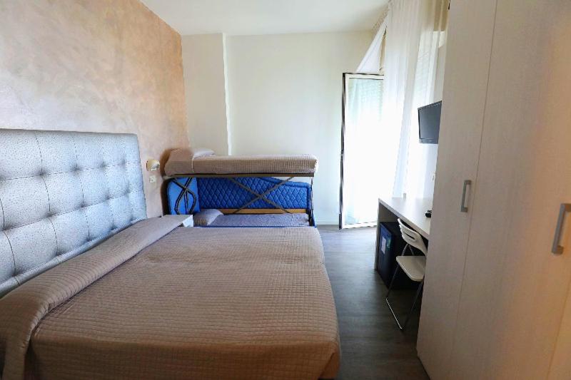 Postel nebo postele na pokoji v ubytování Hotel Daniel's FRONTE MARE