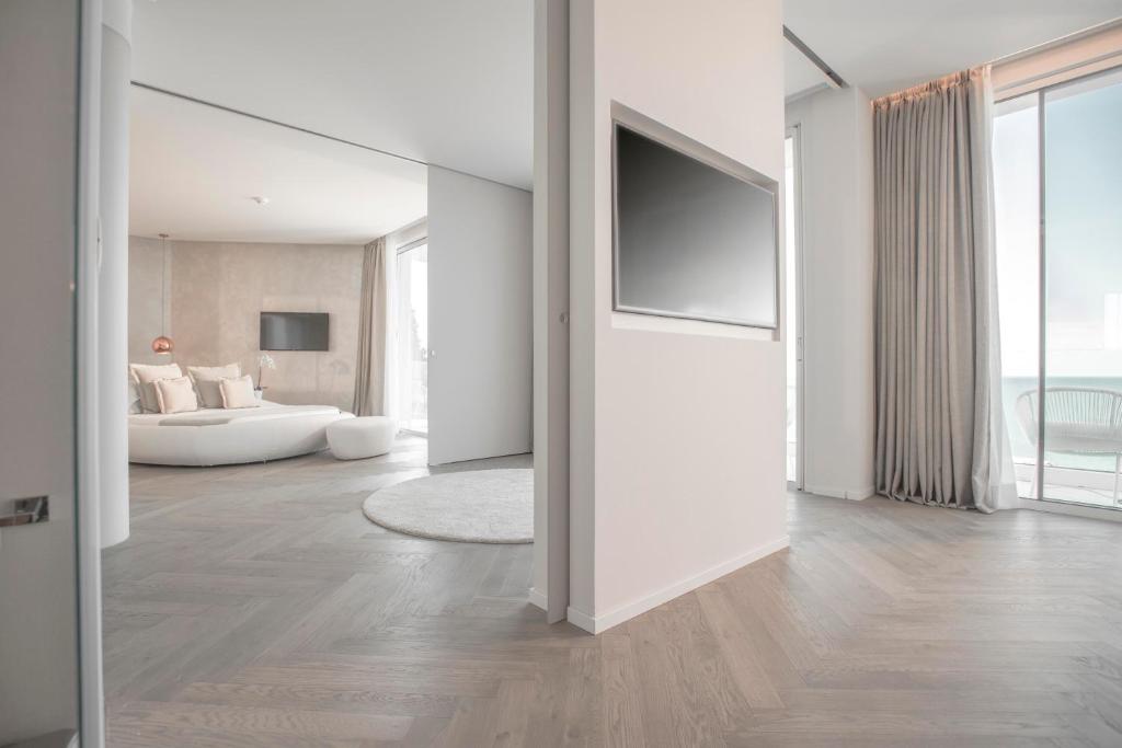 Łóżko lub łóżka w pokoju w obiekcie Hotel Sans Souci