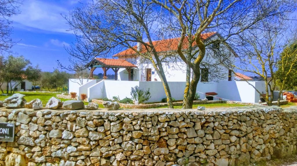 a stone wall in front of a house at House Soni - 800 m from the sea in Rovinj
