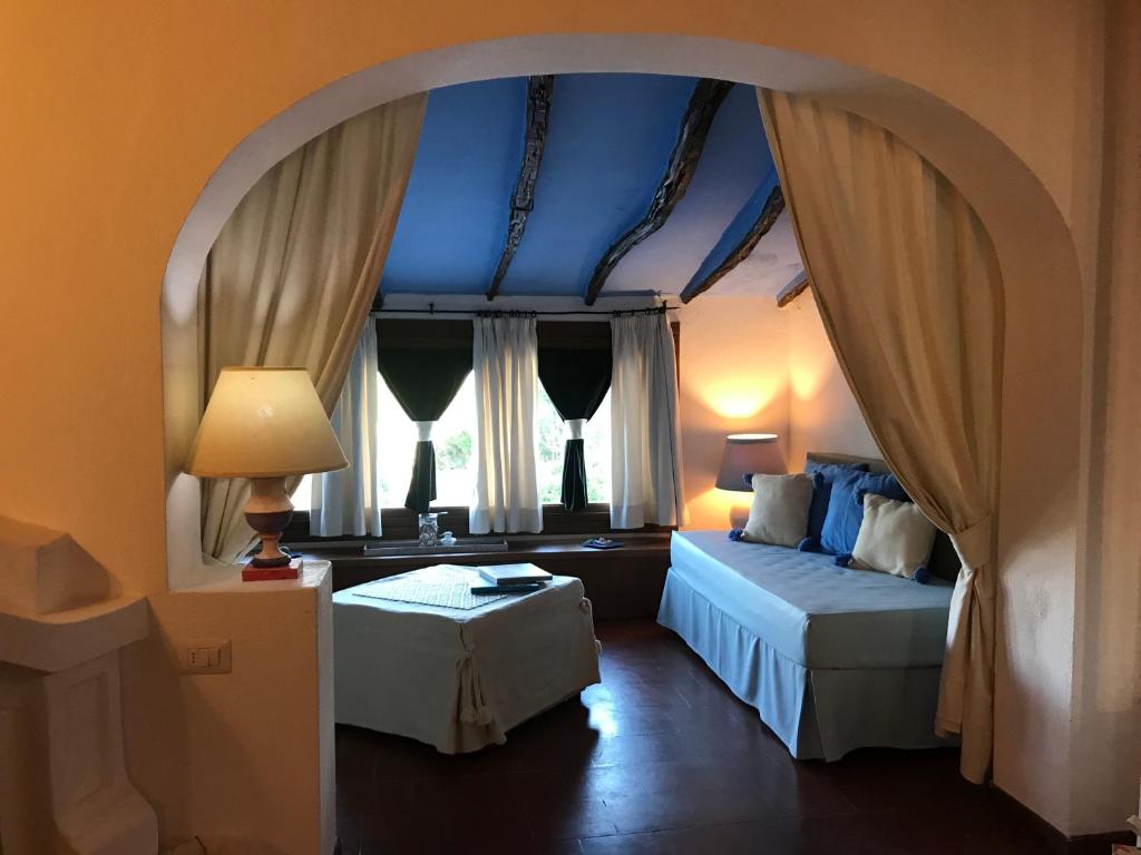 Postel nebo postele na pokoji v ubytování Palmasera Charming Suites