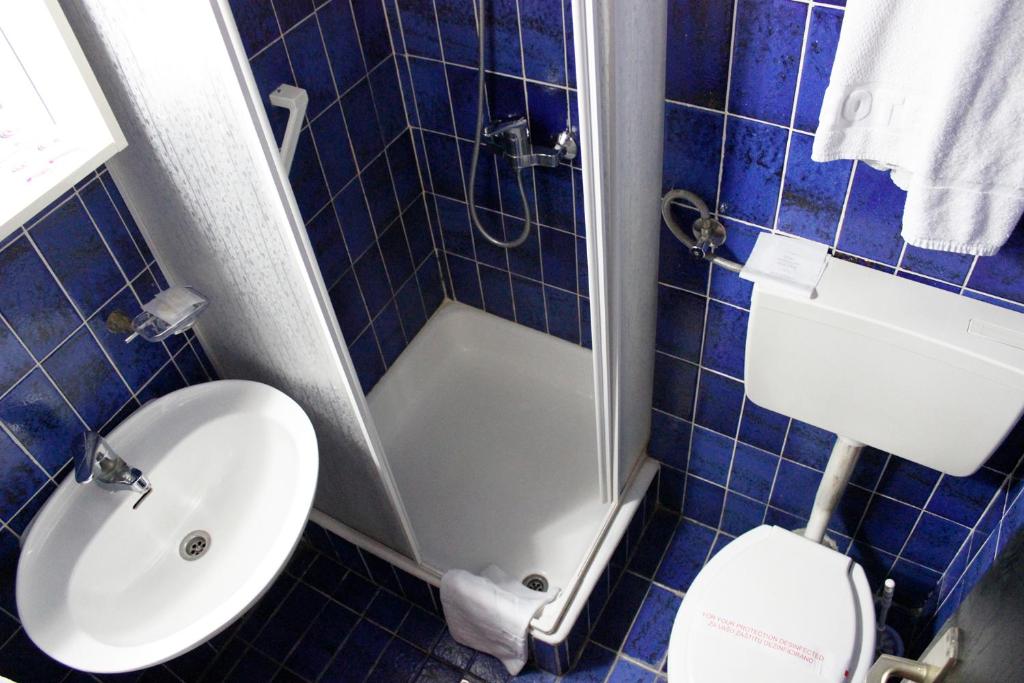 Koupelna v ubytování Hotel Grand