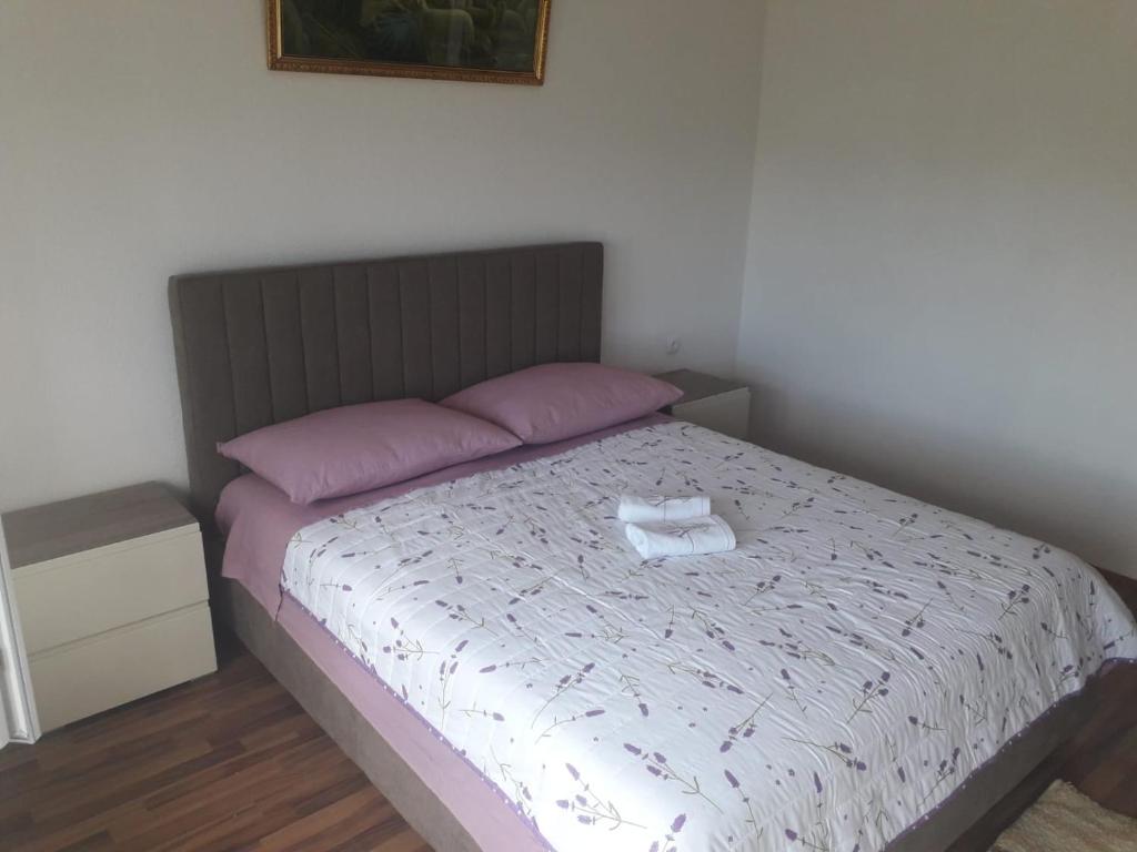 Postel nebo postele na pokoji v ubytování APARTMAN MATKOVIĆ
