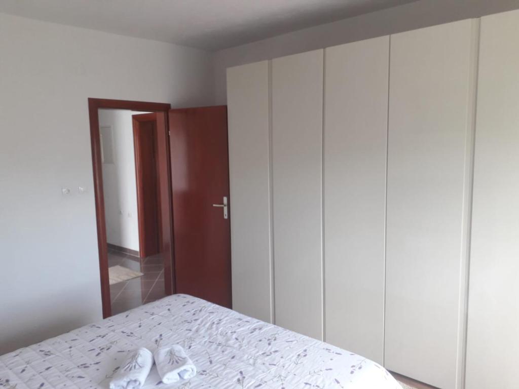 Postel nebo postele na pokoji v ubytování APARTMAN MATKOVIĆ