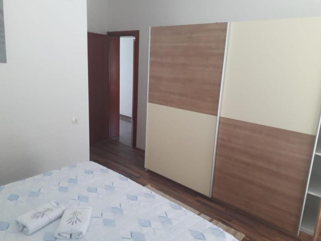Postel nebo postele na pokoji v ubytování APARTMAN MATKOVIĆ