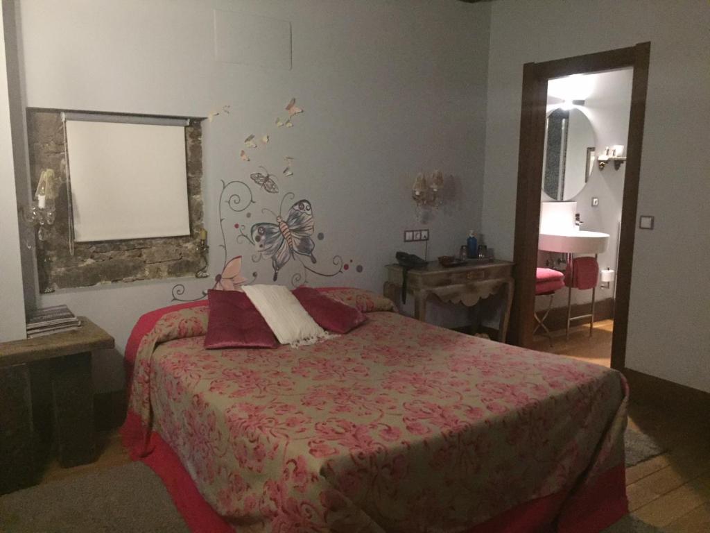 Postel nebo postele na pokoji v ubytování Posada Real Torre Berrueza