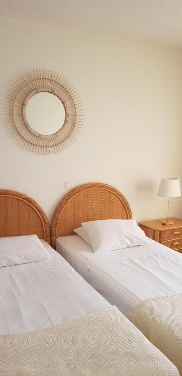 Postel nebo postele na pokoji v ubytování Hotel Le Tilbury