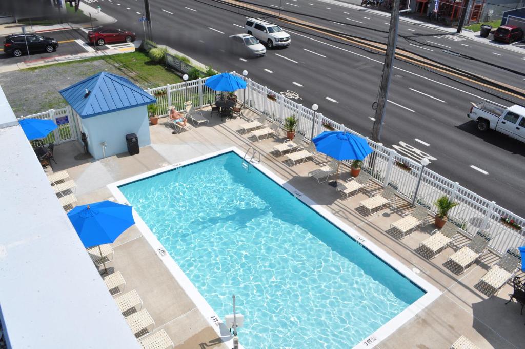 an overhead view of a swimming pool with a highway at Coastal Inn - Ocean City in Ocean City