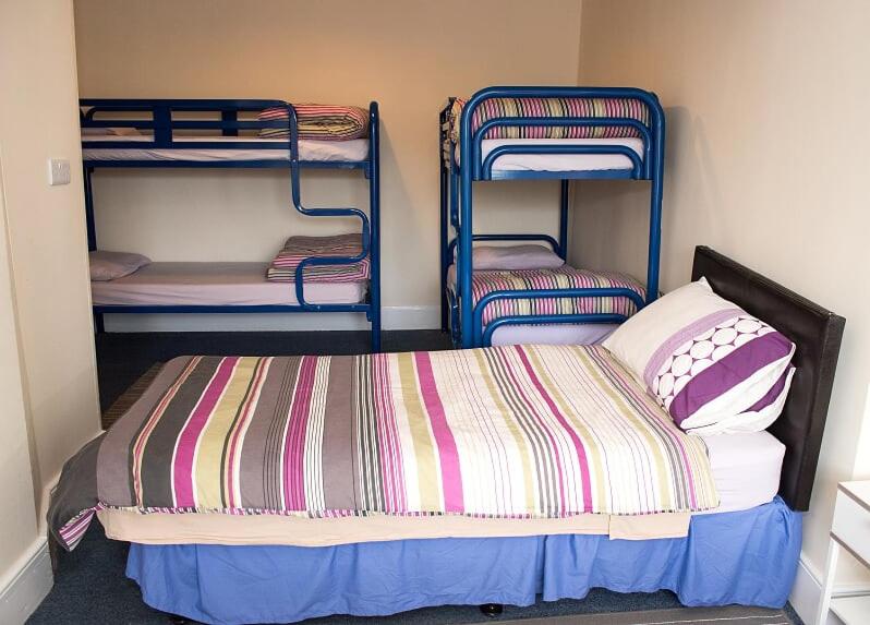 Postel nebo postele na pokoji v ubytování Sive Budget Accommodation