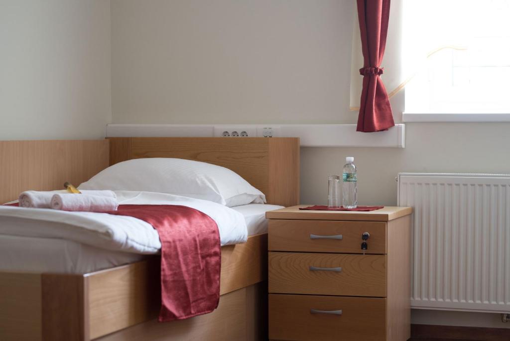 Postel nebo postele na pokoji v ubytování S Hotel