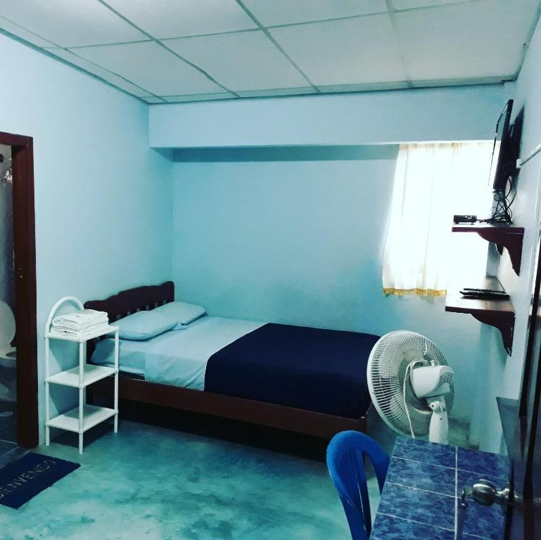 Postel nebo postele na pokoji v ubytování Hostal Aruba