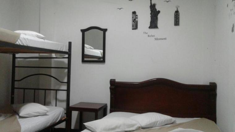 Ένα ή περισσότερα κρεβάτια σε δωμάτιο στο Hostal Balcony