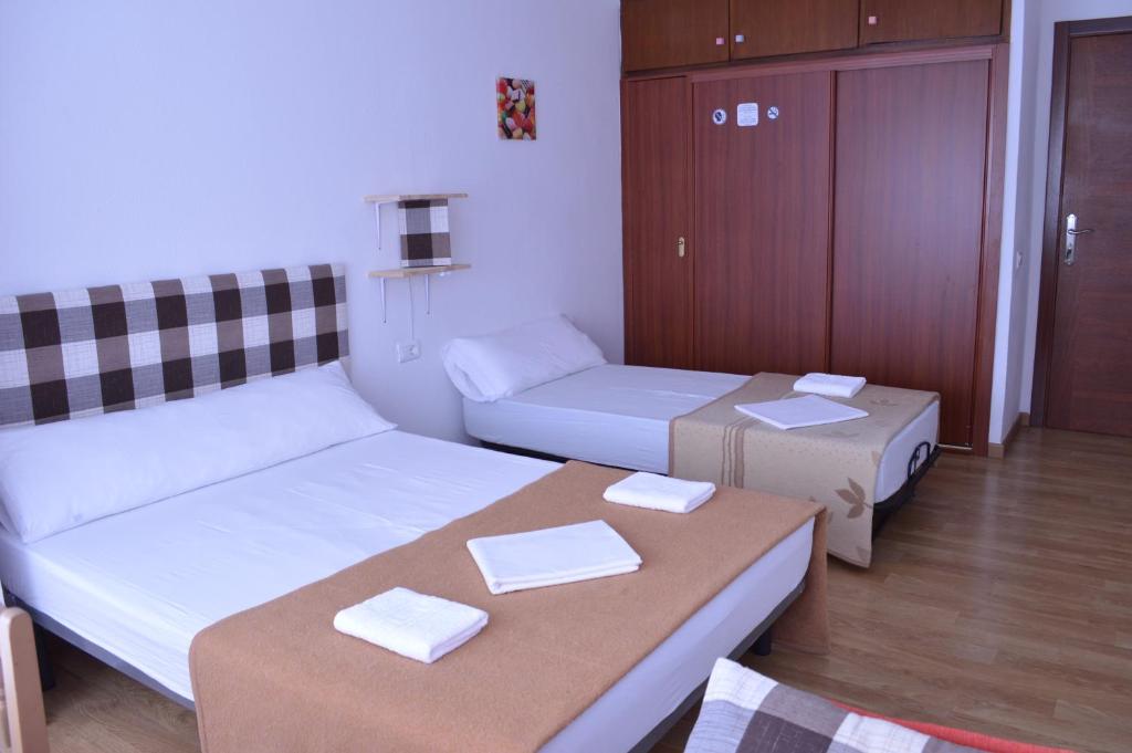 Postel nebo postele na pokoji v ubytování ArArAt Hostel