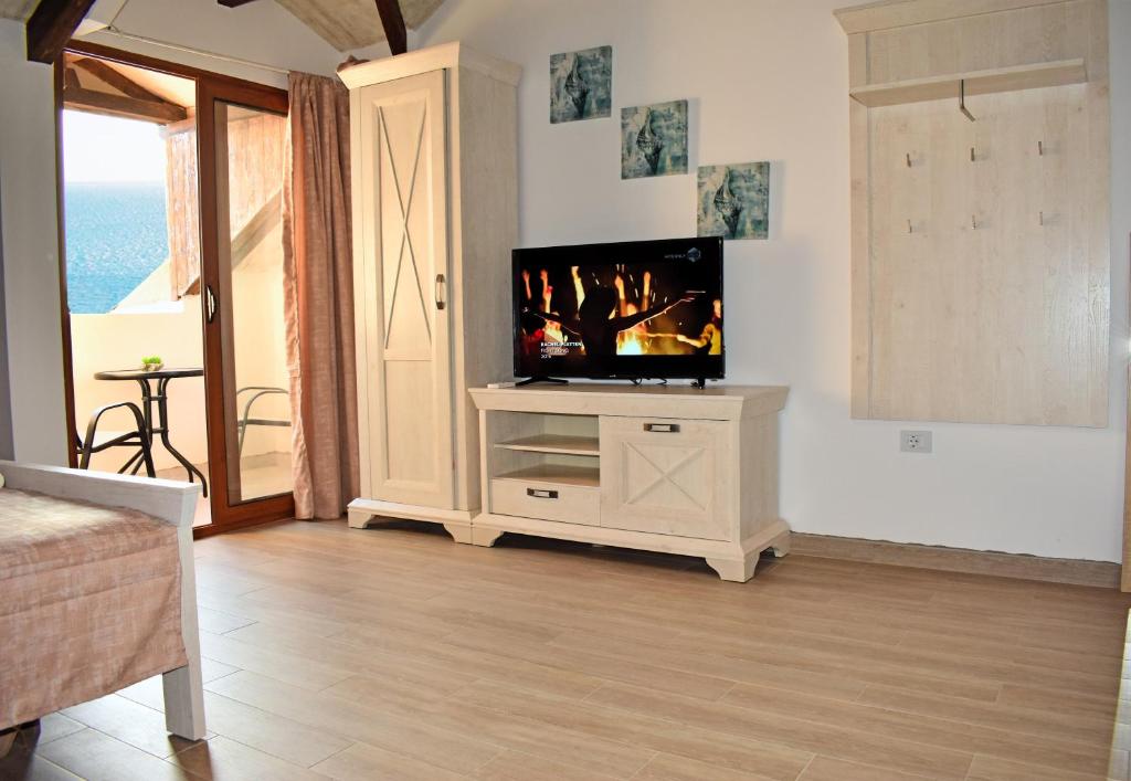 Televiisor ja/või meelelahutuskeskus majutusasutuses Villa Dulcinea