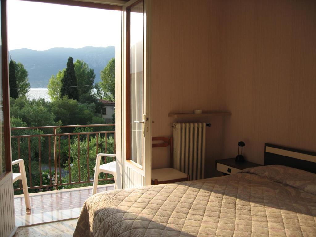 Postel nebo postele na pokoji v ubytování Hotel Zanetti