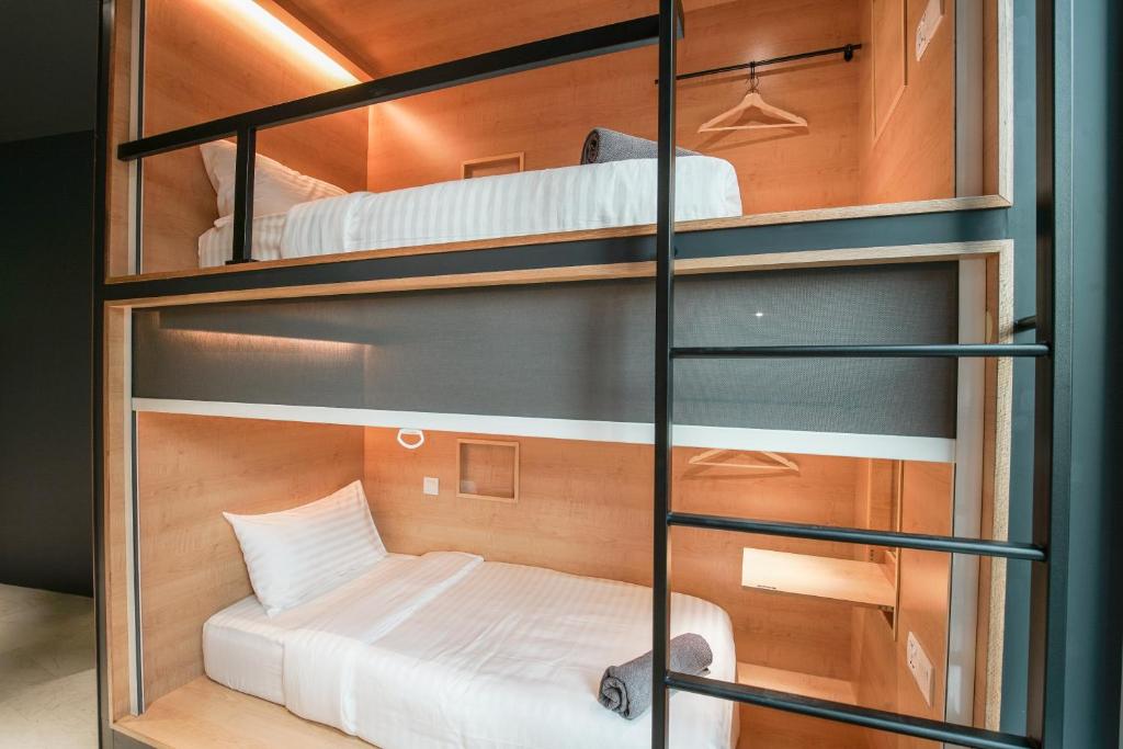 Postel nebo postele na pokoji v ubytování The Bed KLCC