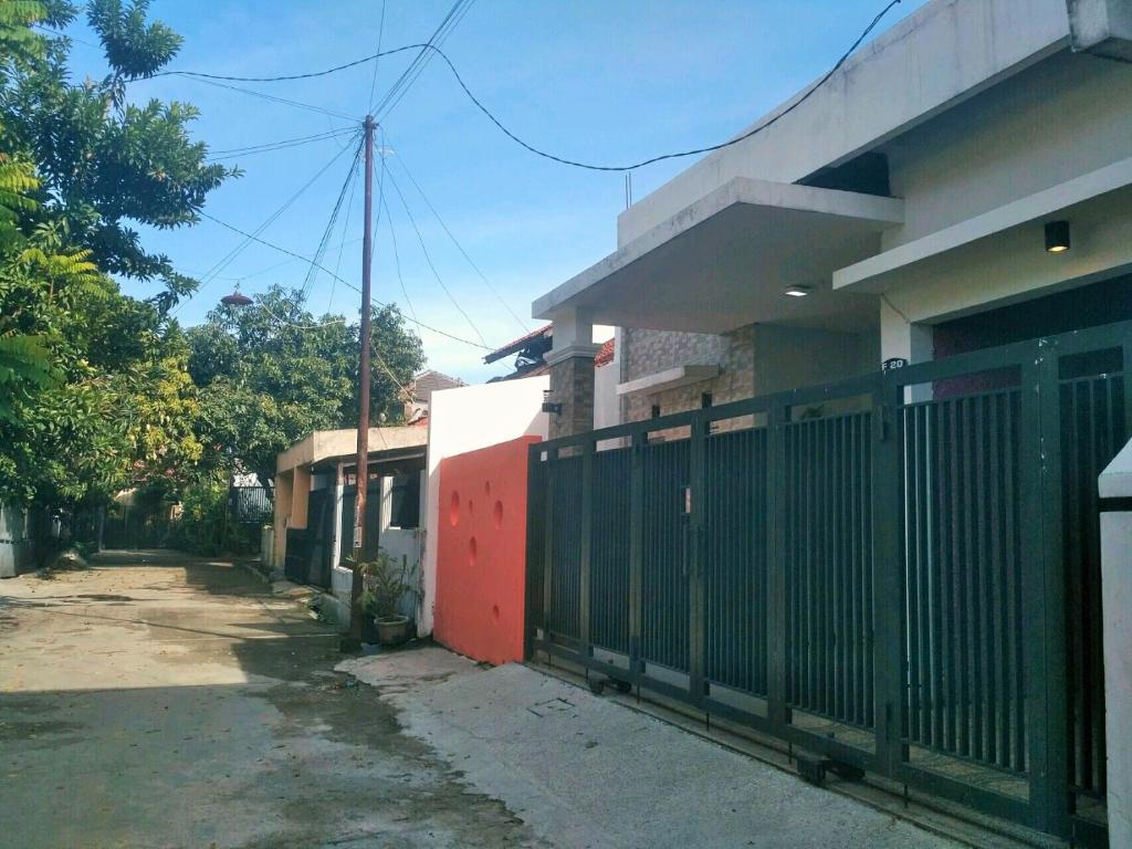 a fence in front of a house at Homestay Bumi Asri III Cikutra in Bandung