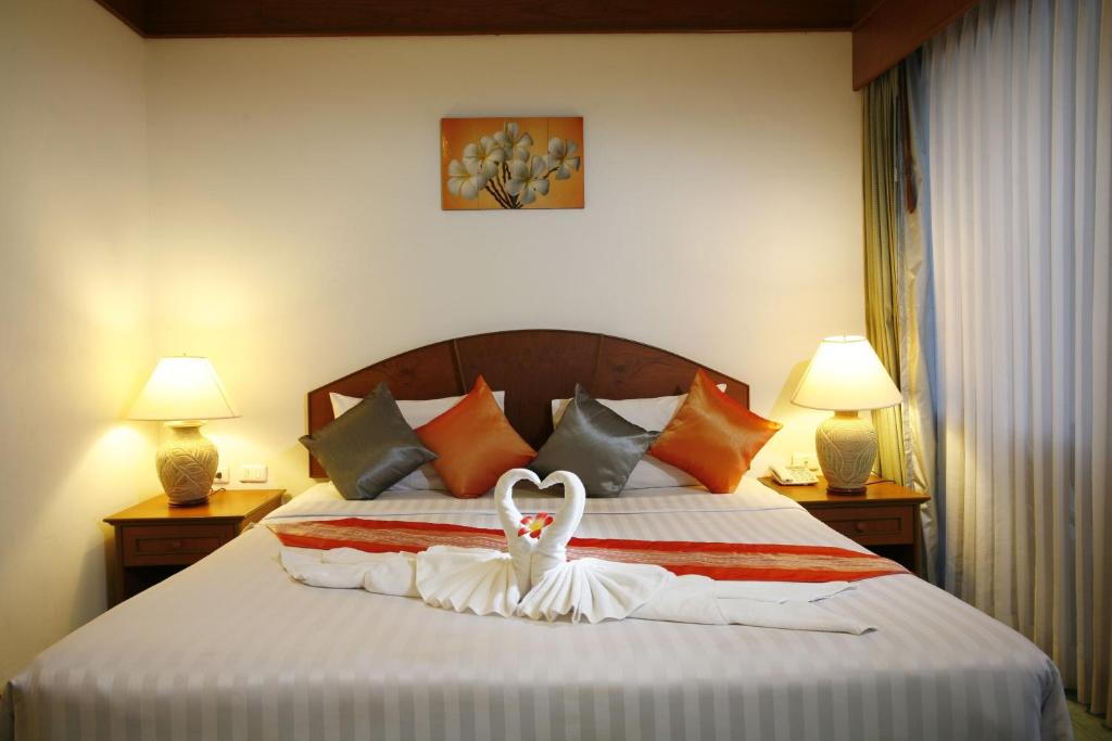 Postel nebo postele na pokoji v ubytování Jiraporn Hill Resort