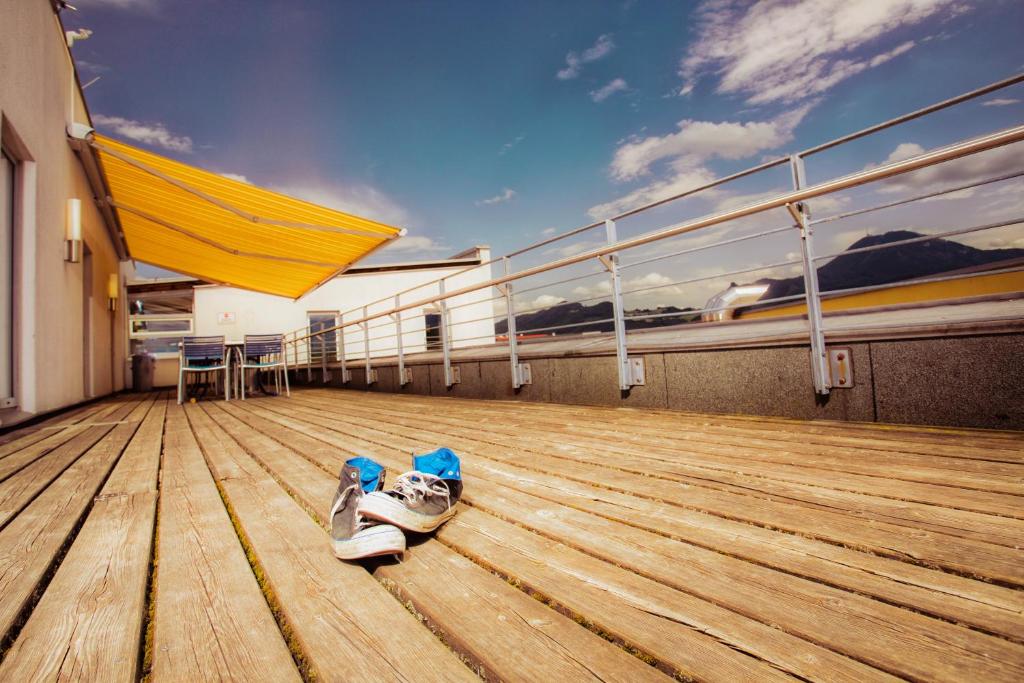 a pair of shoes sitting on the deck of a cruise ship at Kolpinghaus Salzburg in Salzburg