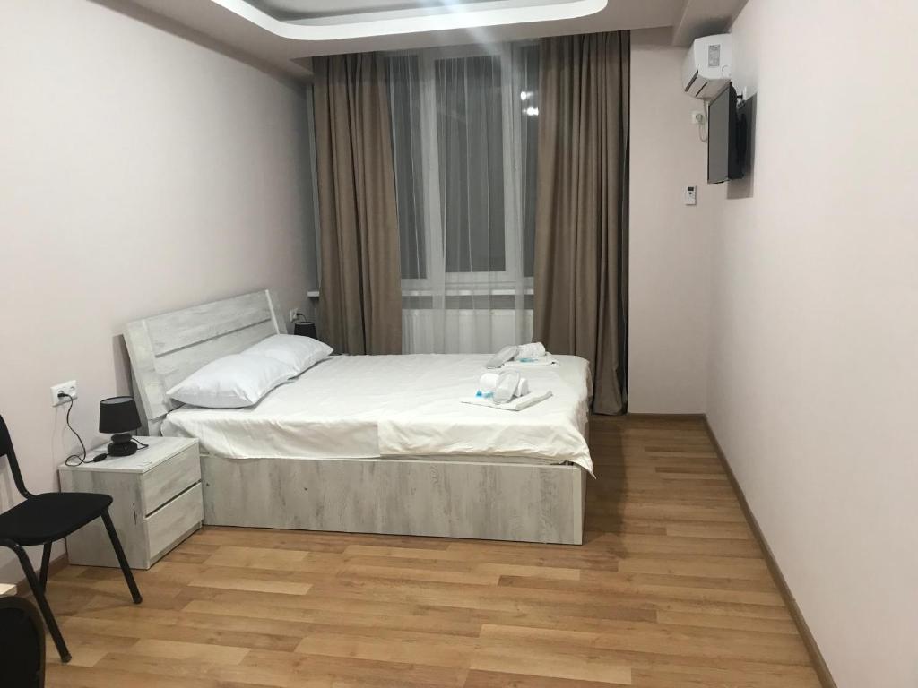 Postel nebo postele na pokoji v ubytování Hotel Caucasus