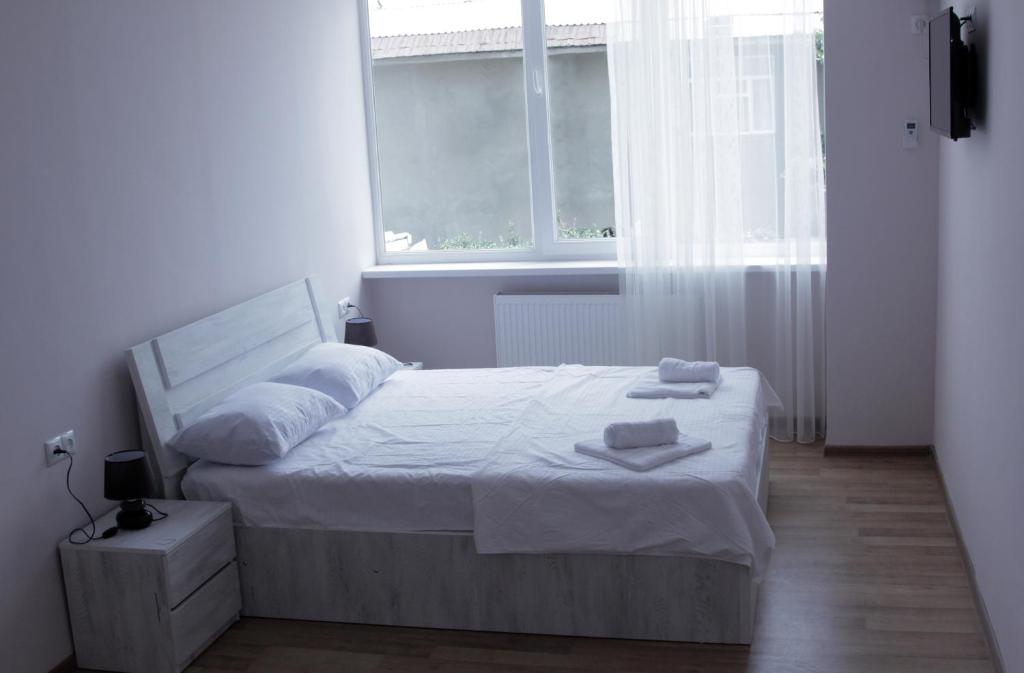 Postel nebo postele na pokoji v ubytování Hotel Caucasus