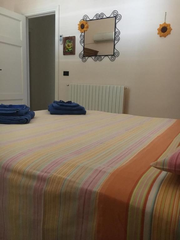 Postel nebo postele na pokoji v ubytování Sole e Girasoli