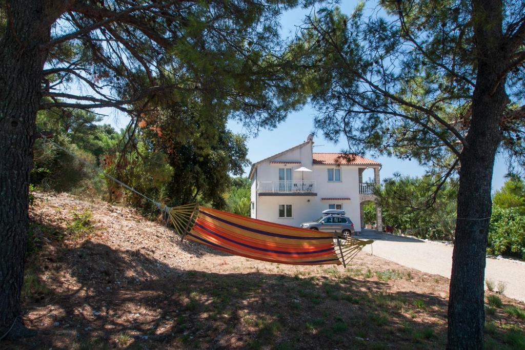 a boat on the ground in front of a house at Heavenly bay in Šibenik