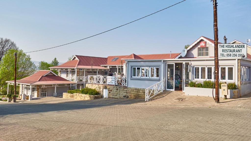 a building on the side of a street at Highland Quarters in Clarens