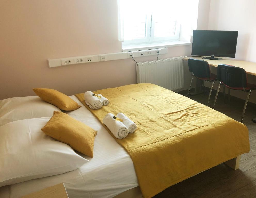 Postel nebo postele na pokoji v ubytování S Hotel