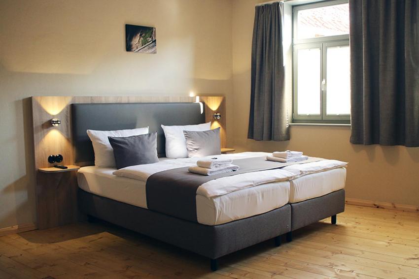 Postel nebo postele na pokoji v ubytování Hotel garni Tilia