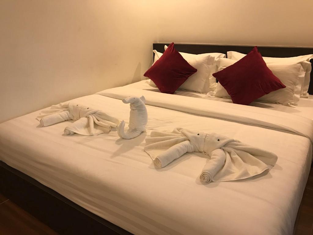 Postel nebo postele na pokoji v ubytování Apple Hotel Two - Near Phnom Penh Airport