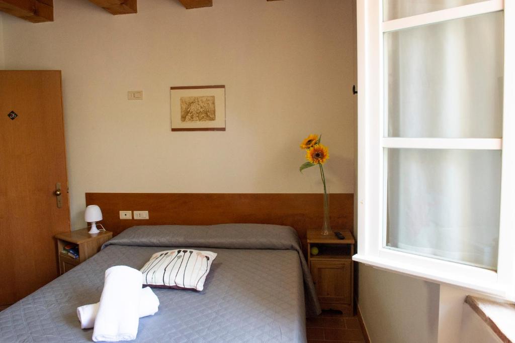 Postel nebo postele na pokoji v ubytování Tenuta Villa Colle Sereno