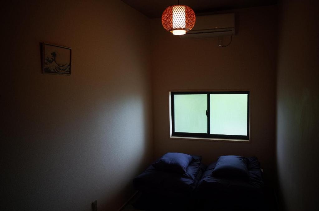 Postel nebo postele na pokoji v ubytování Chambre dhote Tatami