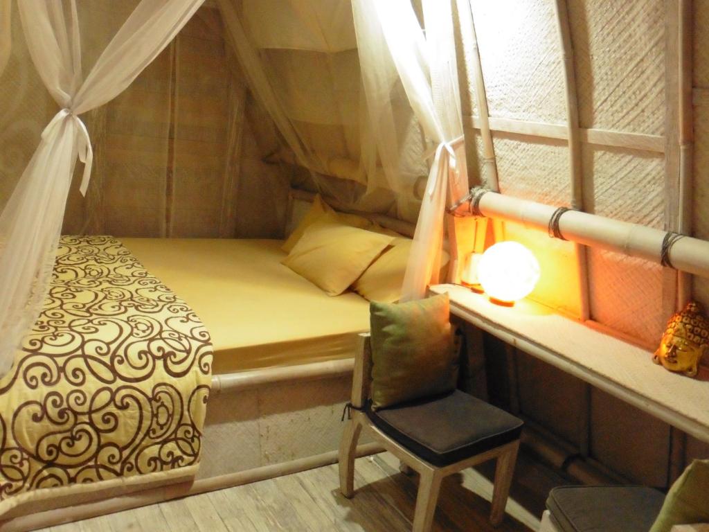Krevet ili kreveti u jedinici u okviru objekta Uma Nandhi Ubud Natural Cottage