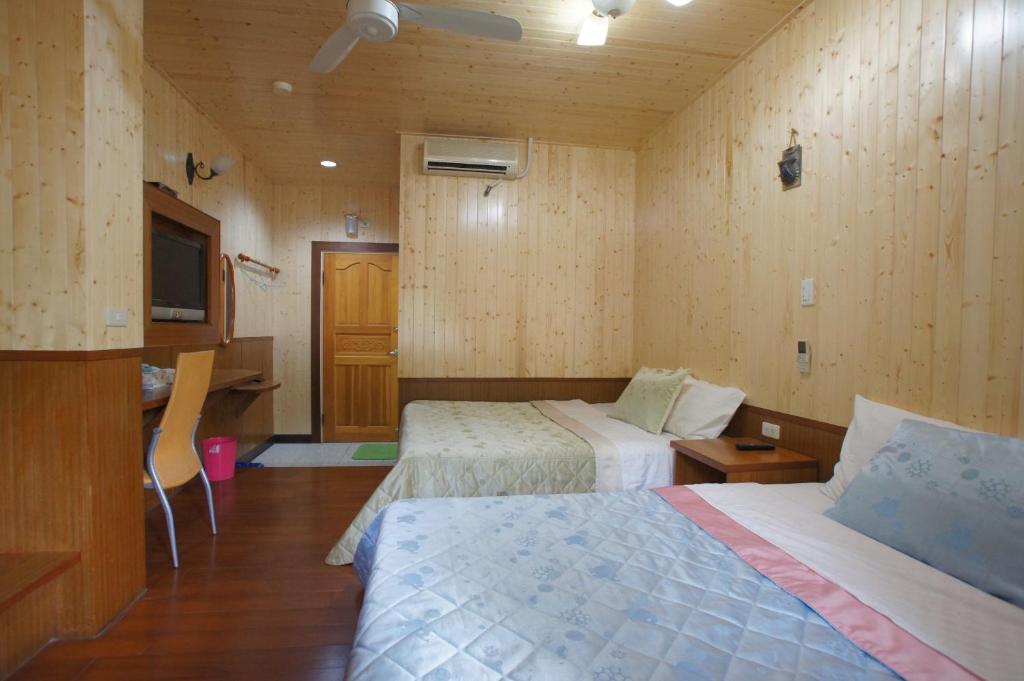 Postel nebo postele na pokoji v ubytování Music House Homestay