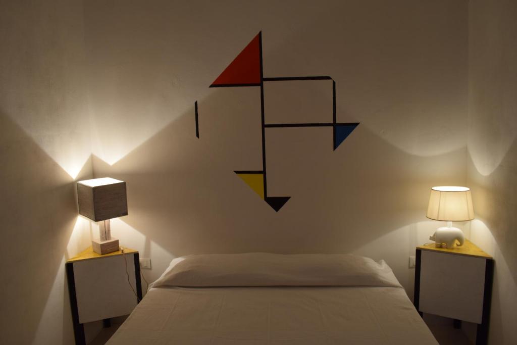 Posteľ alebo postele v izbe v ubytovaní B&B La casa degli artisti