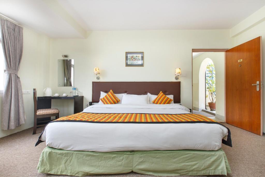 Postel nebo postele na pokoji v ubytování Hotel Serenity