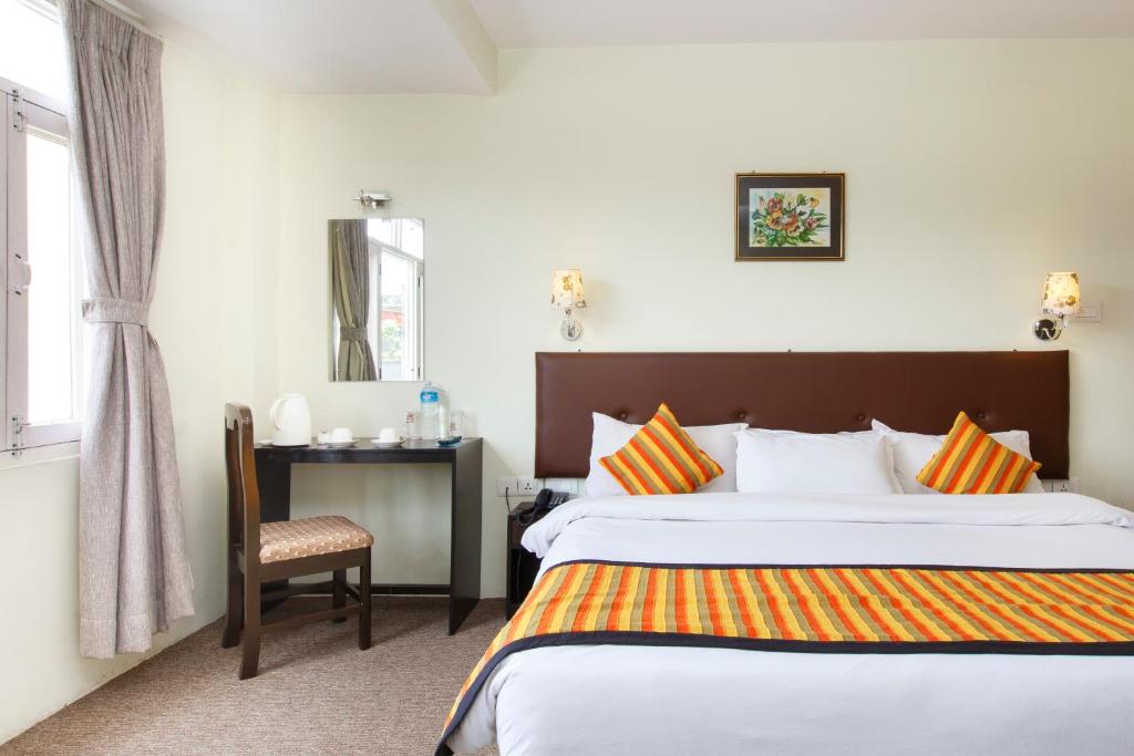 Postel nebo postele na pokoji v ubytování Hotel Serenity