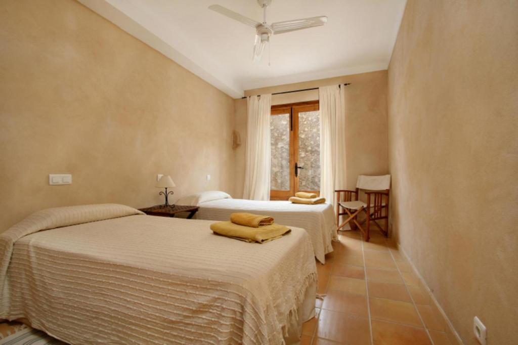 A bed or beds in a room at Teulada