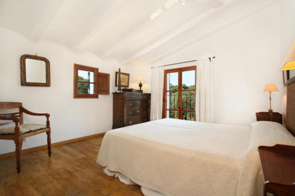 A bed or beds in a room at Teulada