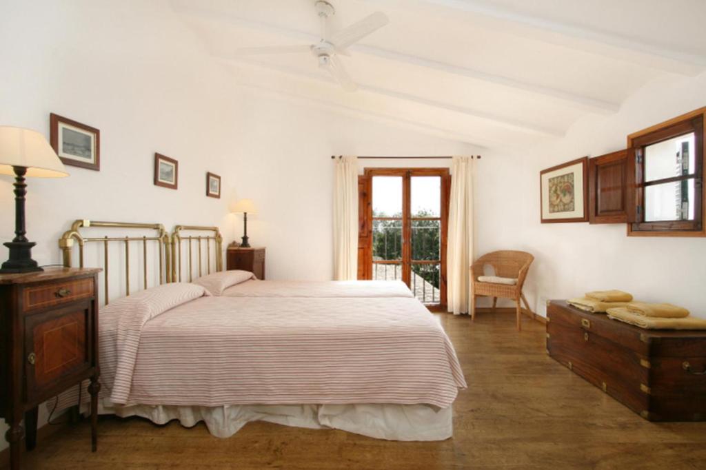A bed or beds in a room at Teulada