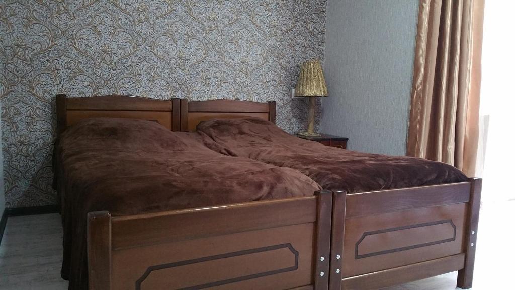 Llit o llits en una habitació de Irakli Guesthouse