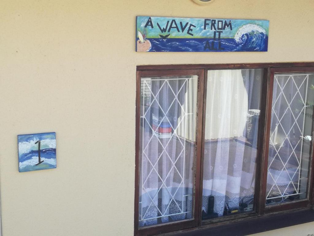 a window with a view from a wave from at A Wave from it all in Port Shepstone