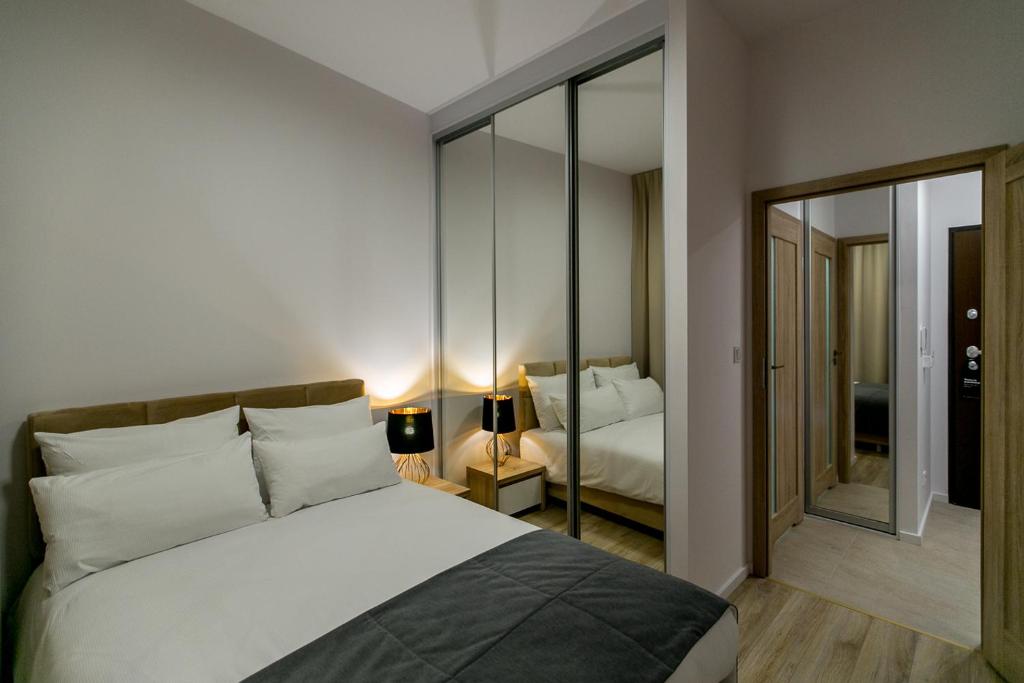 Postel nebo postele na pokoji v ubytování Varsovia Apartamenty Kasprzaka