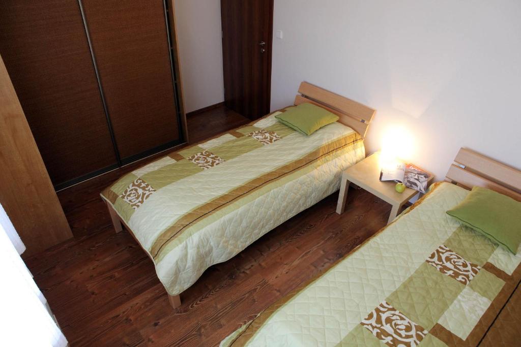 Postel nebo postele na pokoji v ubytování Ski & Sun Wellness Apartments