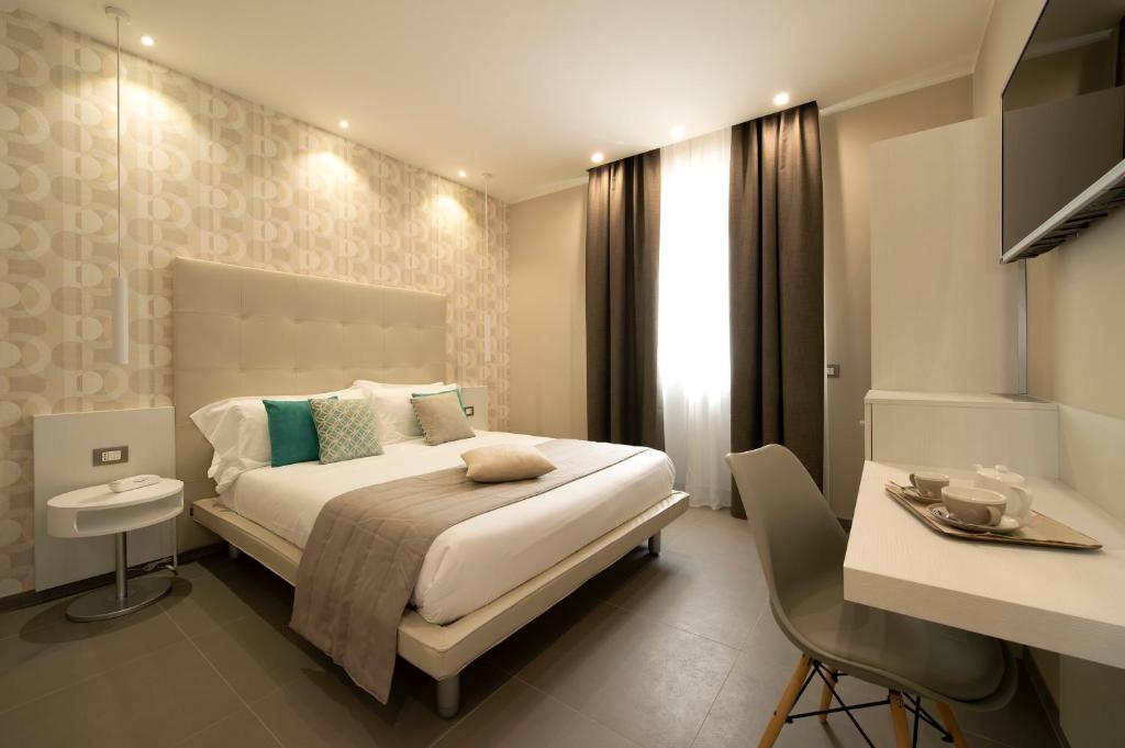 Postel nebo postele na pokoji v ubytování Hotel H21