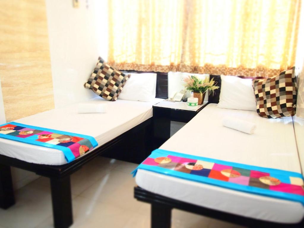 Katil atau katil-katil dalam bilik di Traveller's Hostel