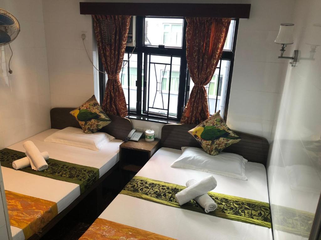 Katil atau katil-katil dalam bilik di Traveller's Hostel