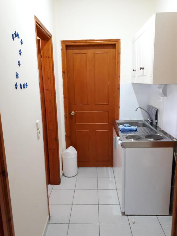Kuchyň nebo kuchyňský kout v ubytování Galaxy Rooms